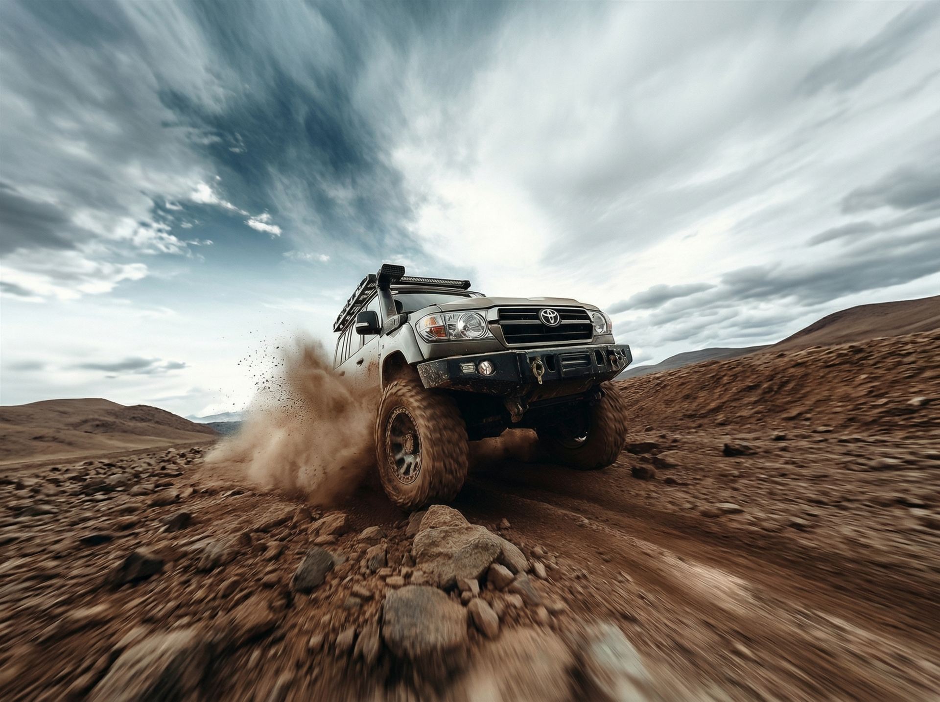 X-Wagens Land Cruiser kicking up dust in the desert